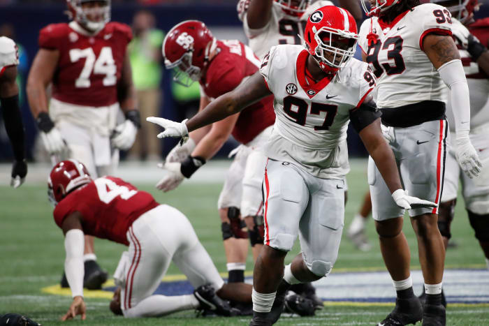 Georgia defensive lineman Warren Brinson (97) celebrates after sacking Alabama quarterback Jalen Milroe (4) during the first half of the SEC Championship game against Alabama at Mercedes-Benz Stadium in Atlanta, on Saturday, Dec. 2, 2023.
